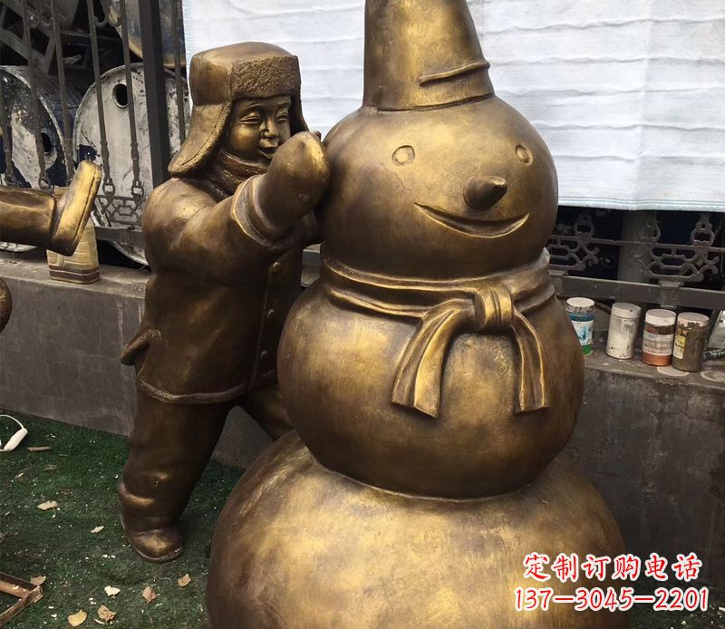 温州戴帽子堆雪人的儿童铜雕