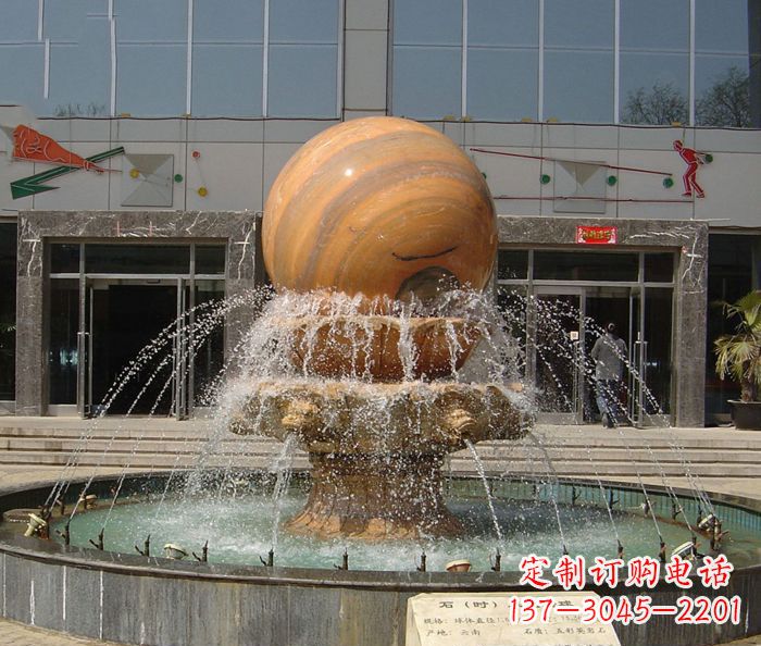 温州石来运转球晚霞红风水球石雕