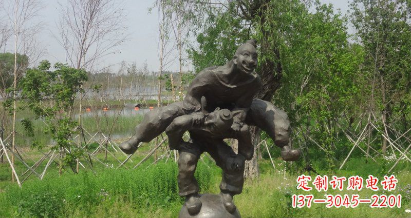 温州园林站在球上面跳山羊的人物景观铜雕